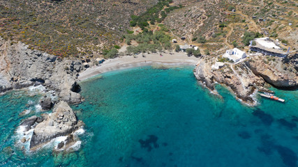 Aerial drone photo of secluded deep turquoise beach of Agios Nikolaos with crystal clear sea and sandy sea shore, Folegandros island, Cyclades, Greece