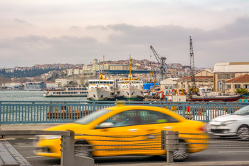 Evening traffic  long exposure  yellow turkish taxi car on istanbul 