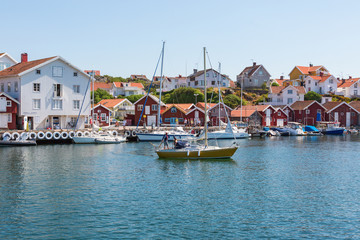 Fototapeta na wymiar Harbor with boats and houses in an old fishing village