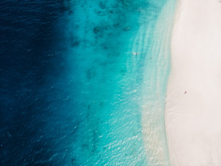 Fototapeta na wymiar Beautiful tropical beach with turquoise crystal ocean, aerial view. Gili islands
