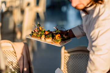 woman arranging flowers in shop