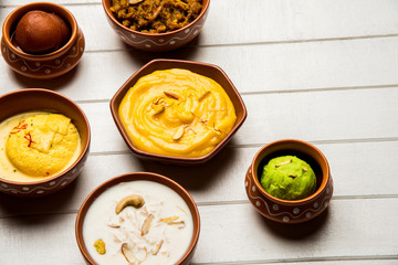 group of Indian Sweet / mithai in terracotta bowl