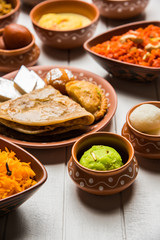 group of Indian Sweet / mithai in terracotta bowl