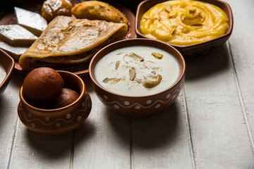 group of Indian Sweet / mithai in terracotta bowl