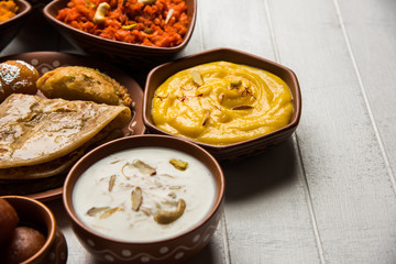 group of Indian Sweet / mithai in terracotta bowl