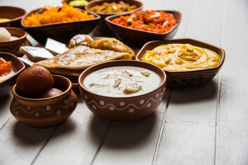 group of Indian Sweet / mithai in terracotta bowl