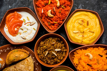 group of Indian Sweet / mithai in terracotta bowl