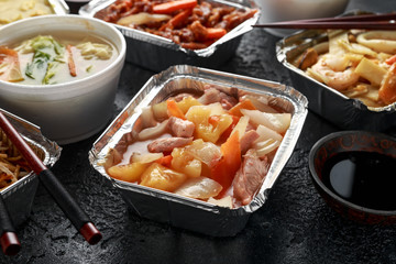 Chinese takeaway food. Pork Wonton dumpling soup, Crispy shredded beef, sweet and sour pineapple chicken, egg noodles with bean sprouts, curry.