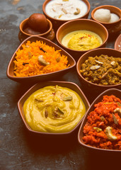group of Indian Sweet / mithai in terracotta bowl