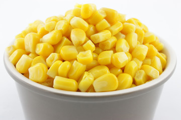 corn in a bowl isolated on white background