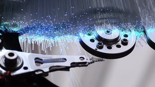 Opened Hard Disk Drive with Fiber Optics background, Shot in 4K UHD