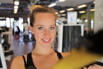 Sporty young woman working out in the gym