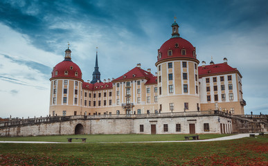 Idillic morning scene. Moritzburg Castle near Dresden with sky during of sunrise. Wonderful autumn sunrise in Saxony, Dresden, Germany, Europe. Popular Places for photographers. Creative image