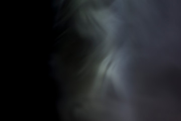 White smoke on a black background