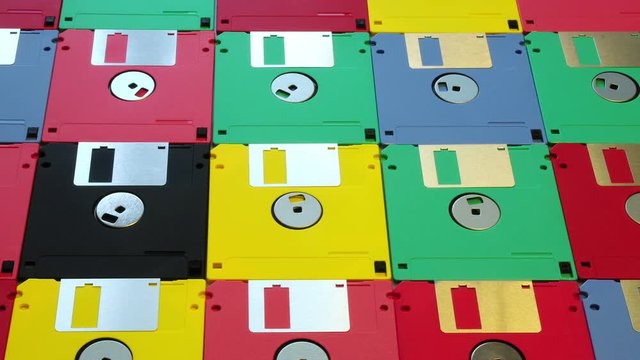 Close up view of many colored computer floppy disks or diskette allineated, vintage technology.