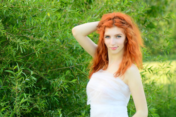 Obraz premium A young beautiful ore girl of the Caucasian appearance is having fun with pineapple. Place for text.Vegan, vegetarianism, healthy lifestyle, positive concept
