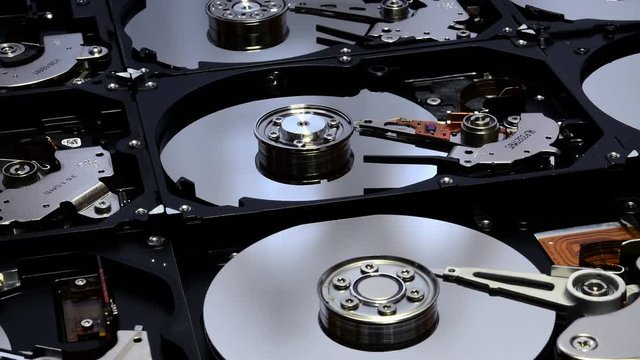 Closeup on opened Hard Disk Drives. Internals of Hard Disk Drives. Shot in 4K UHD