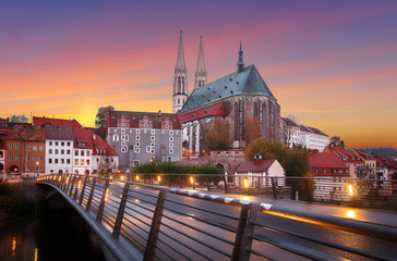 Fantastic colorful sky under sunlit during sunset, over the Church of St. Peter and Paul in Gorlitz, Germany, Wonderful picturesque scene, Amazing Colorful Cityscape. Awesome creative image. Postcard