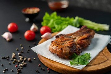 spicy beef steak cooked on a coal or barbecued, pepper and green letucce lay arounds