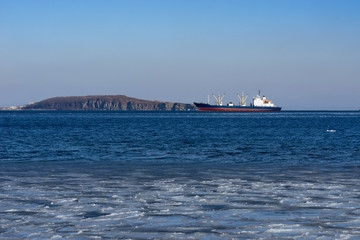 Ship cargo ship on the background of the seascape