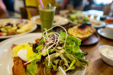 plates with dishes. stand on steel, salads, desserts and fruits