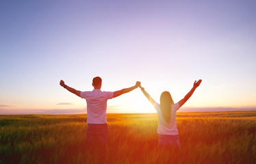 Couple feeling free in a beautiful natural setting.