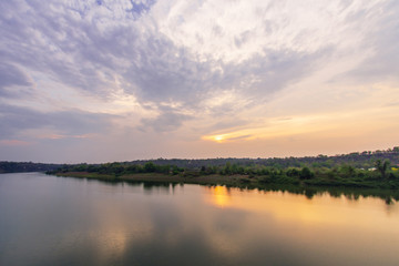 Fototapeta na wymiar Beautiful reflection of twilight cloudscape at Mun river.