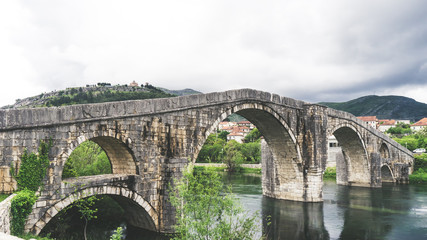 The historic monument of the Arslanagic bridge (old bridge) in Trebinje. Historical stone bridge and river in Bosnia and Herzegovina