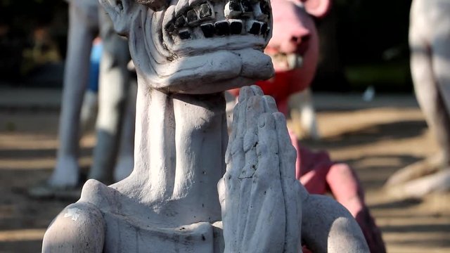 The ghost of sinner with his hands clasped. A scene from Buddhist hell. Torture of sinful people, afterlife.