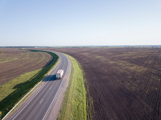 Aerial Top View of Truck with Cargo Semi Trailer Moving on Road in Direction