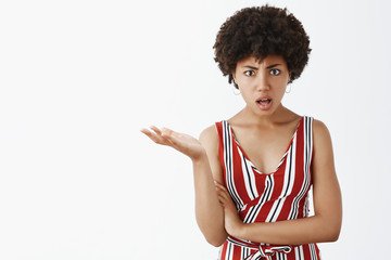 Are you out of mind. Portrait of confused and pissed good-looking bossy female in striped blouse,...