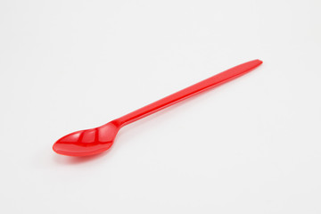 Red plastic spoon