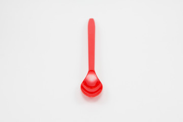 Red plastic spoon