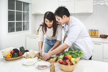 Young couple cooking together