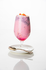 Falooda / Faluda is a popular Indian dessert - Strawberry and Mango flavoured which has Ice cream, noodles, sweet basil seeds and nuts, selective focus