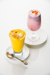 Falooda / Faluda is a popular Indian dessert - Strawberry and Mango flavoured which has Ice cream, noodles, sweet basil seeds and nuts, selective focus