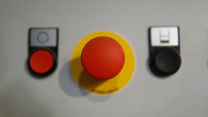Plastic red stop button for industrial process with others buttons