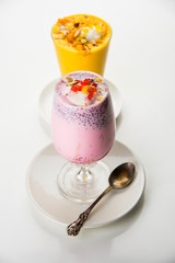 Falooda / Faluda is a popular Indian dessert - Strawberry and Mango flavoured which has Ice cream, noodles, sweet basil seeds and nuts, selective focus