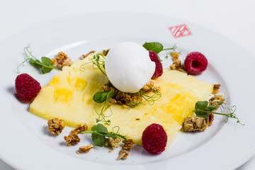 cake with ice cream and raspberries