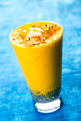 Falooda / Faluda is a popular Indian dessert - Strawberry and Mango flavoured which has Ice cream, noodles, sweet basil seeds and nuts, selective focus