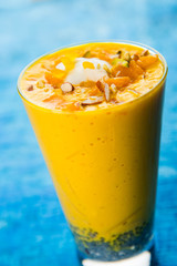 Falooda / Faluda is a popular Indian dessert - Strawberry and Mango flavoured which has Ice cream, noodles, sweet basil seeds and nuts, selective focus