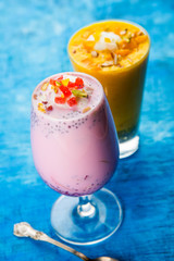 Falooda / Faluda is a popular Indian dessert - Strawberry and Mango flavoured which has Ice cream, noodles, sweet basil seeds and nuts, selective focus