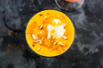 Falooda / Faluda is a popular Indian dessert - Strawberry and Mango flavoured which has Ice cream, noodles, sweet basil seeds and nuts, selective focus