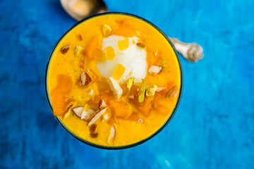 Falooda / Faluda is a popular Indian dessert - Strawberry and Mango flavoured which has Ice cream, noodles, sweet basil seeds and nuts, selective focus