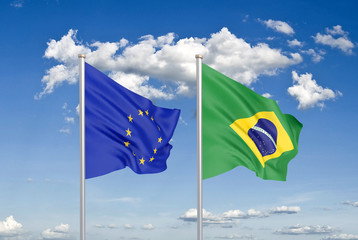 European Union vs Brazil. Thick colored silky flags of European Union and Brazil. 3D illustration on sky background. - Illustration
