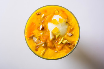 Falooda / Faluda is a popular Indian dessert - Strawberry and Mango flavoured which has Ice cream, noodles, sweet basil seeds and nuts, selective focus