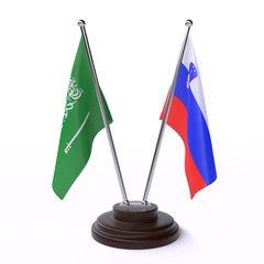 Saudi Arabia and Slovenia, two table flags isolated on white background. 3d image
