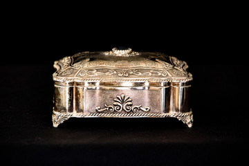 Silver vintage square jewelry box in black background