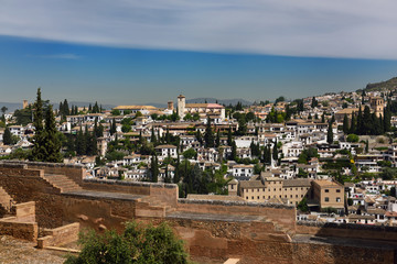 View of Albaicin Church of Saint Nicholas lookout and Iglesia del Salvador from Alhambra wall in Granada Spain