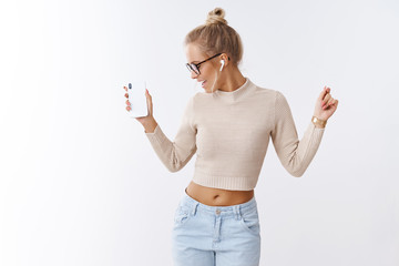 Stylish glamour and carefree caucasian woman in cropped sweater glasses turning away joyfully...